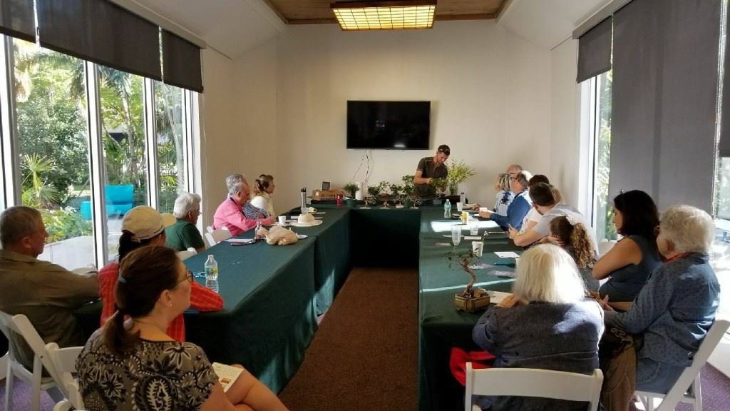 Group bonsai design workshop in a bright studio